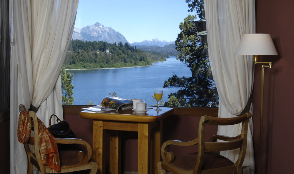 View from a suite at Charming: each room frames Lake Nahuel Huapi like a natural painting.